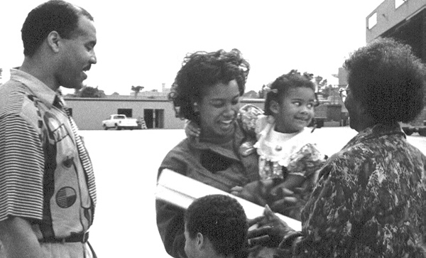 Jennifer is greeted by her family after a six month Navy deployment 